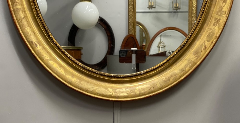French oval figured gilt mirror View V