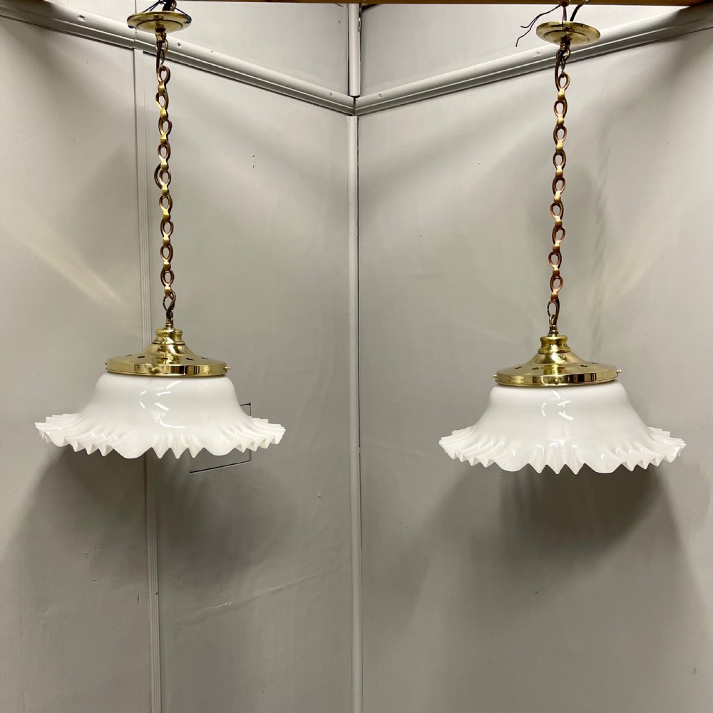 Pair of hanging opaline and brass lights 