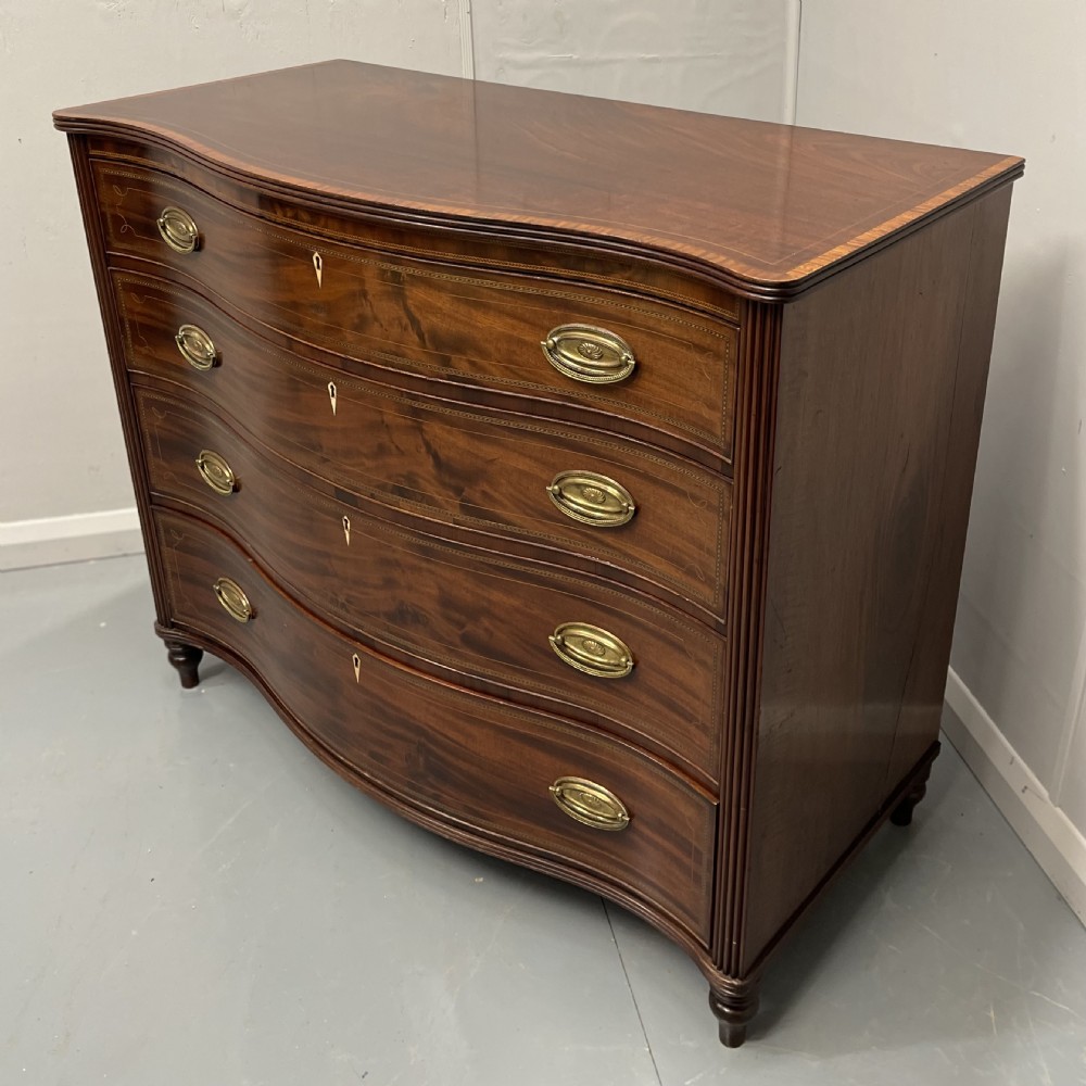 Georgian inlaid serpentine chest of drawers