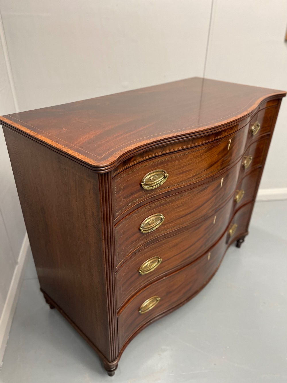 Georgian inlaid serpentine chest of drawers View III
