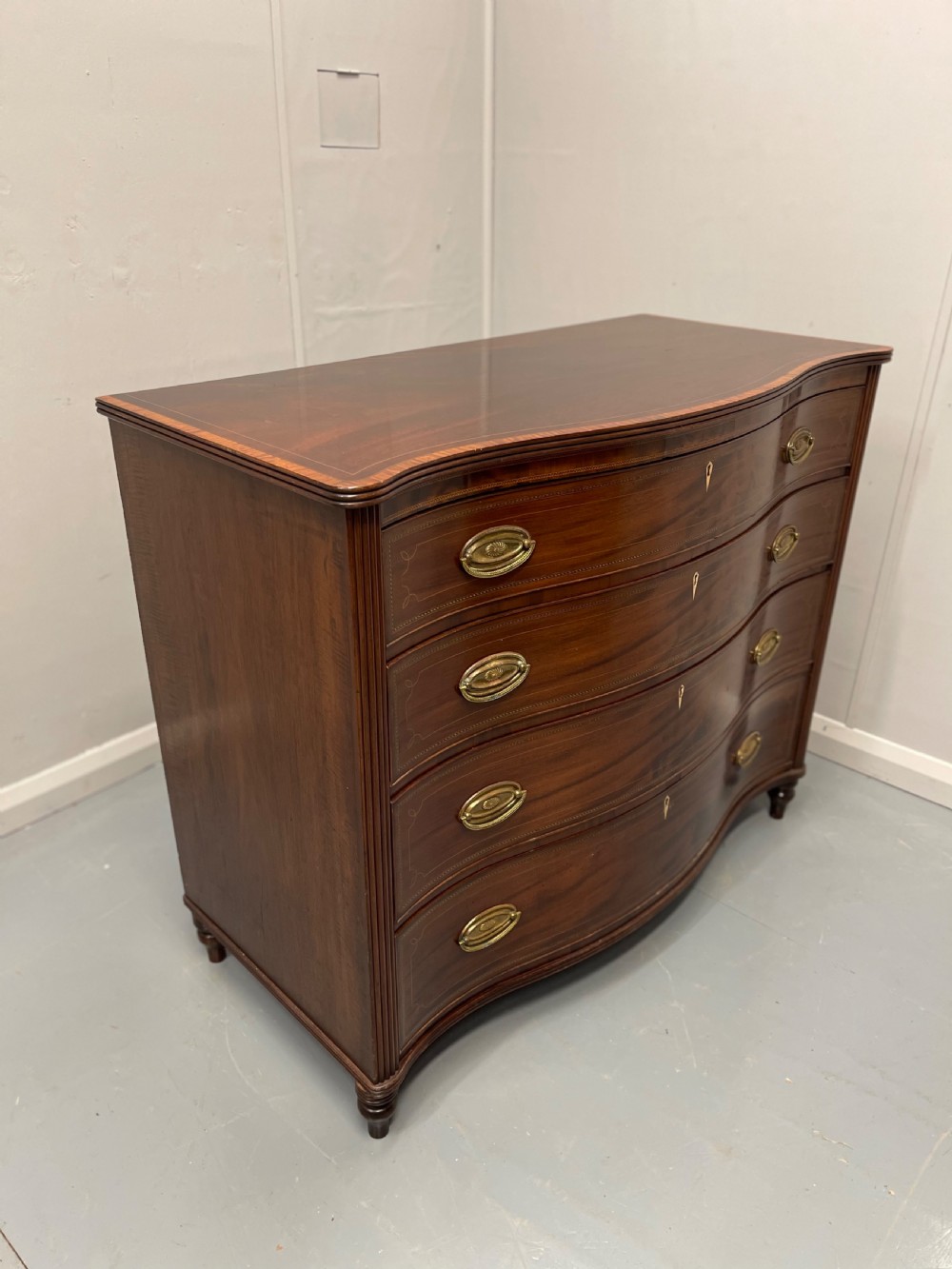 Georgian inlaid serpentine chest of drawers View IX