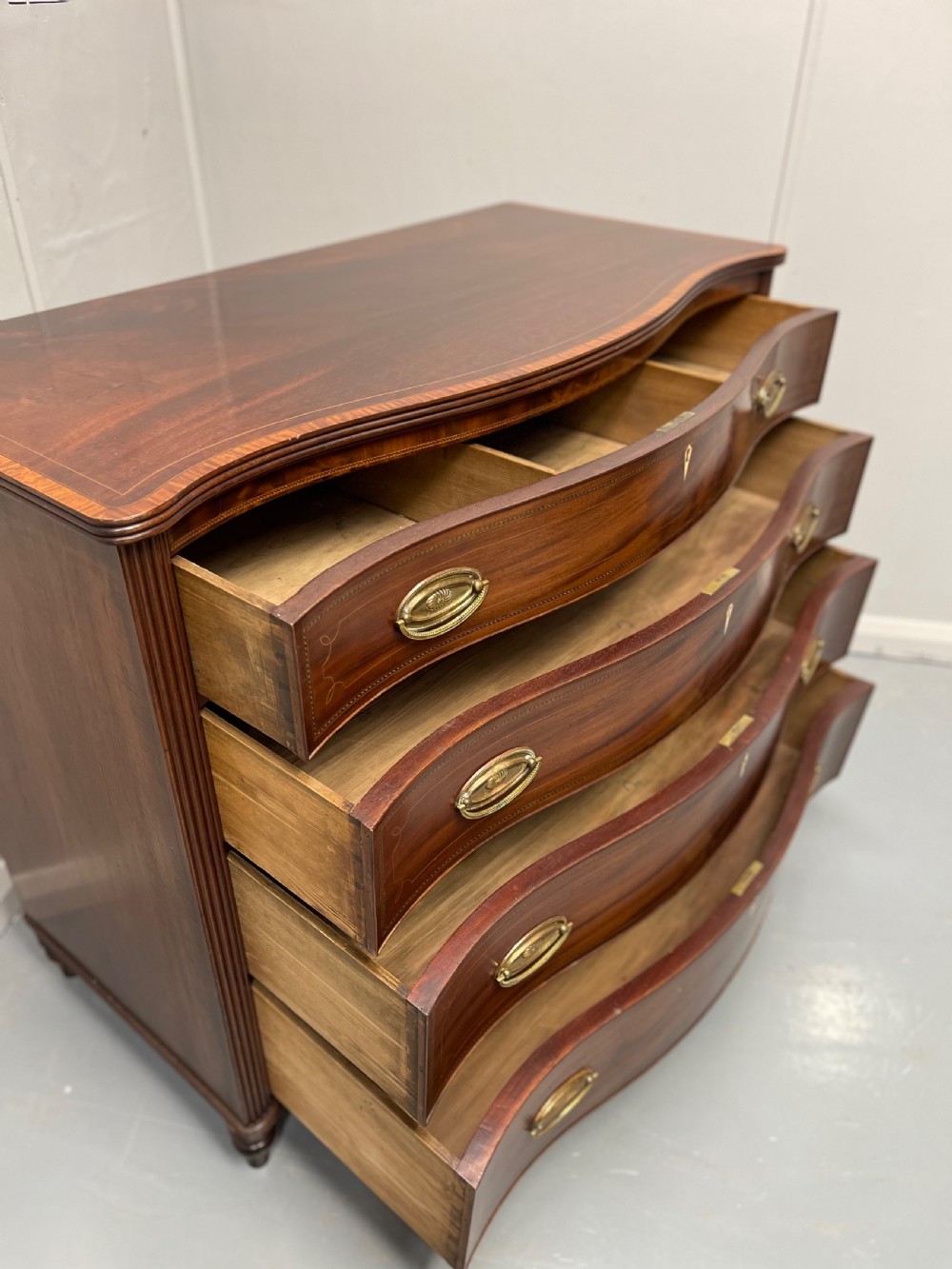 Georgian inlaid serpentine chest of drawers View X