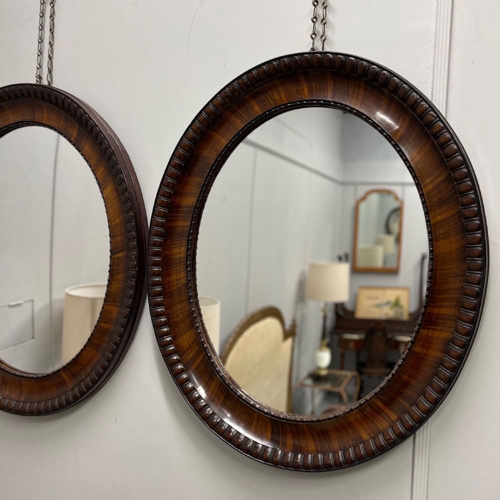 Pair of rosewood oval mirrors  View II
