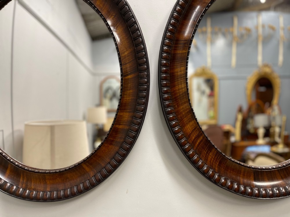Pair of rosewood oval mirrors  View V