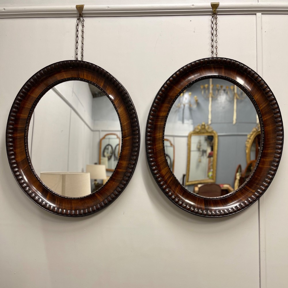 Pair of rosewood oval mirrors  View VII