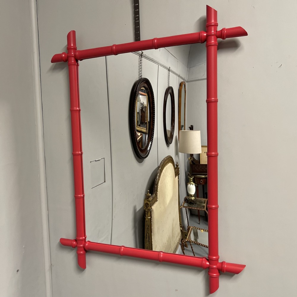 Red lacquered faux bamboo mirror