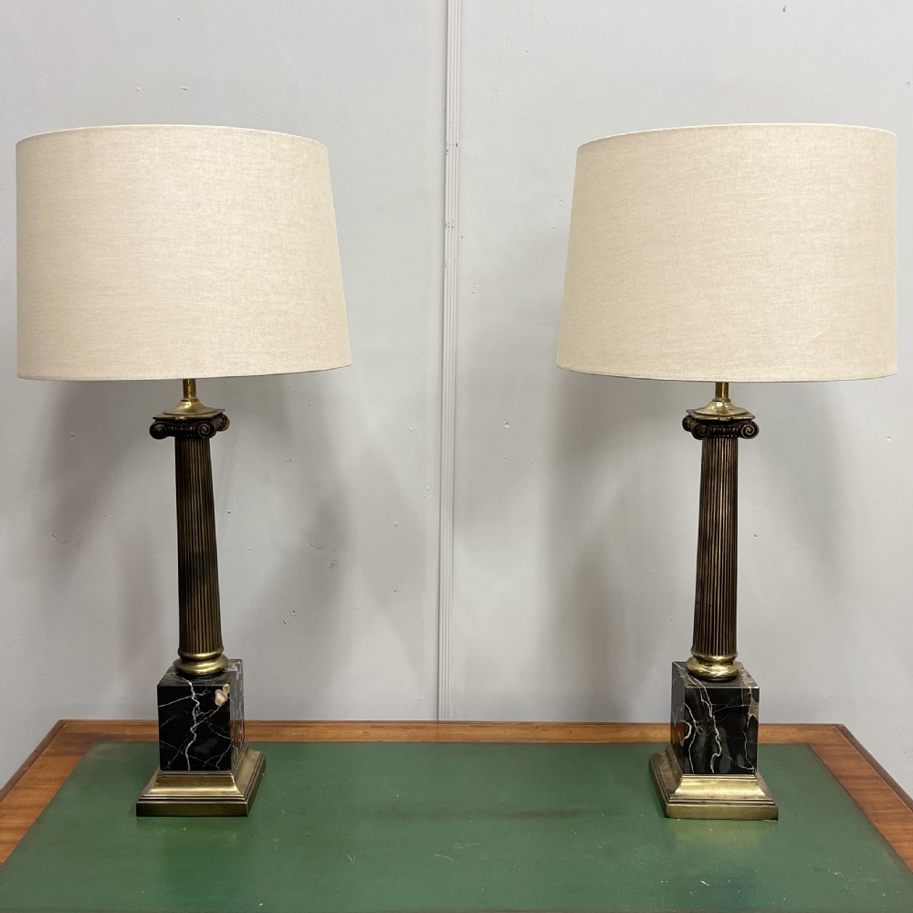 Pair of brass and marble column lamps, inc postage