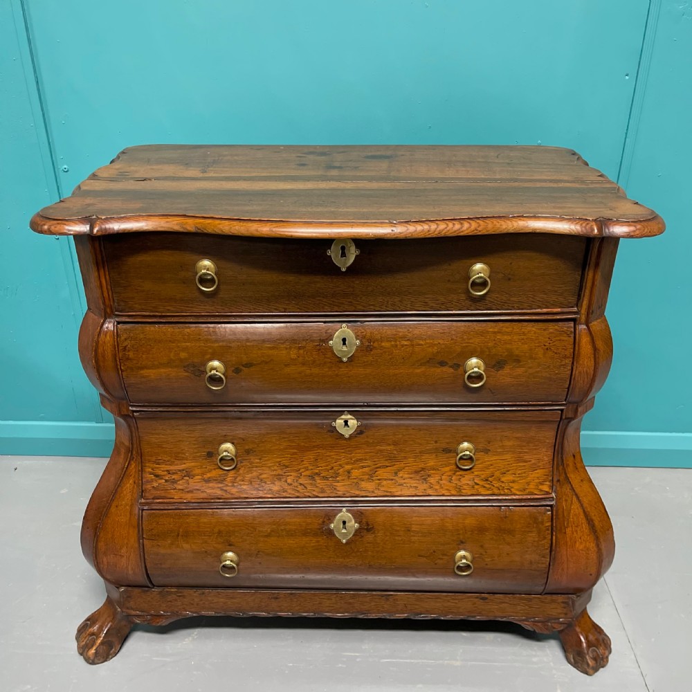 Dutch oak chest of drawers on lions paw feet