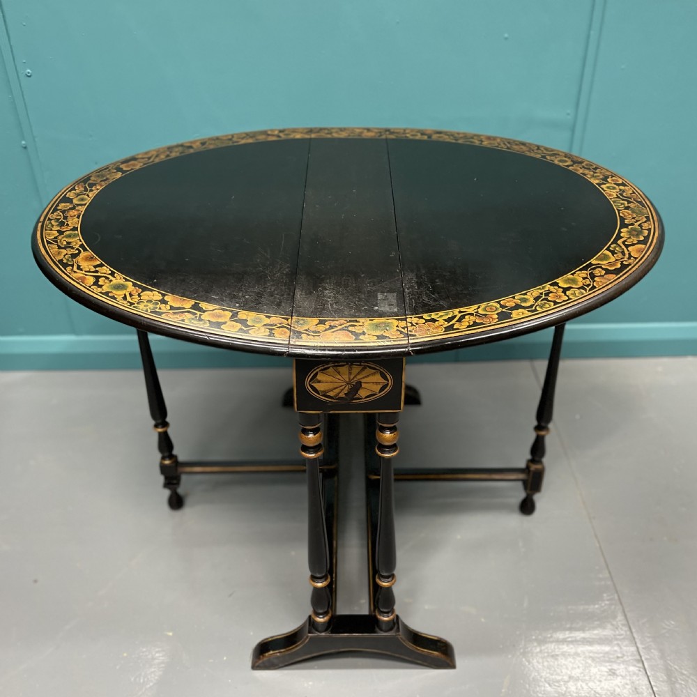 Black lacquered and decorated Sutherland side table