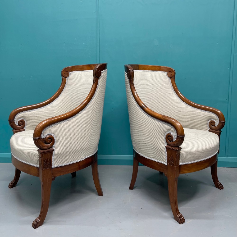 Newly upholstered pair of French Empire tub chairs
