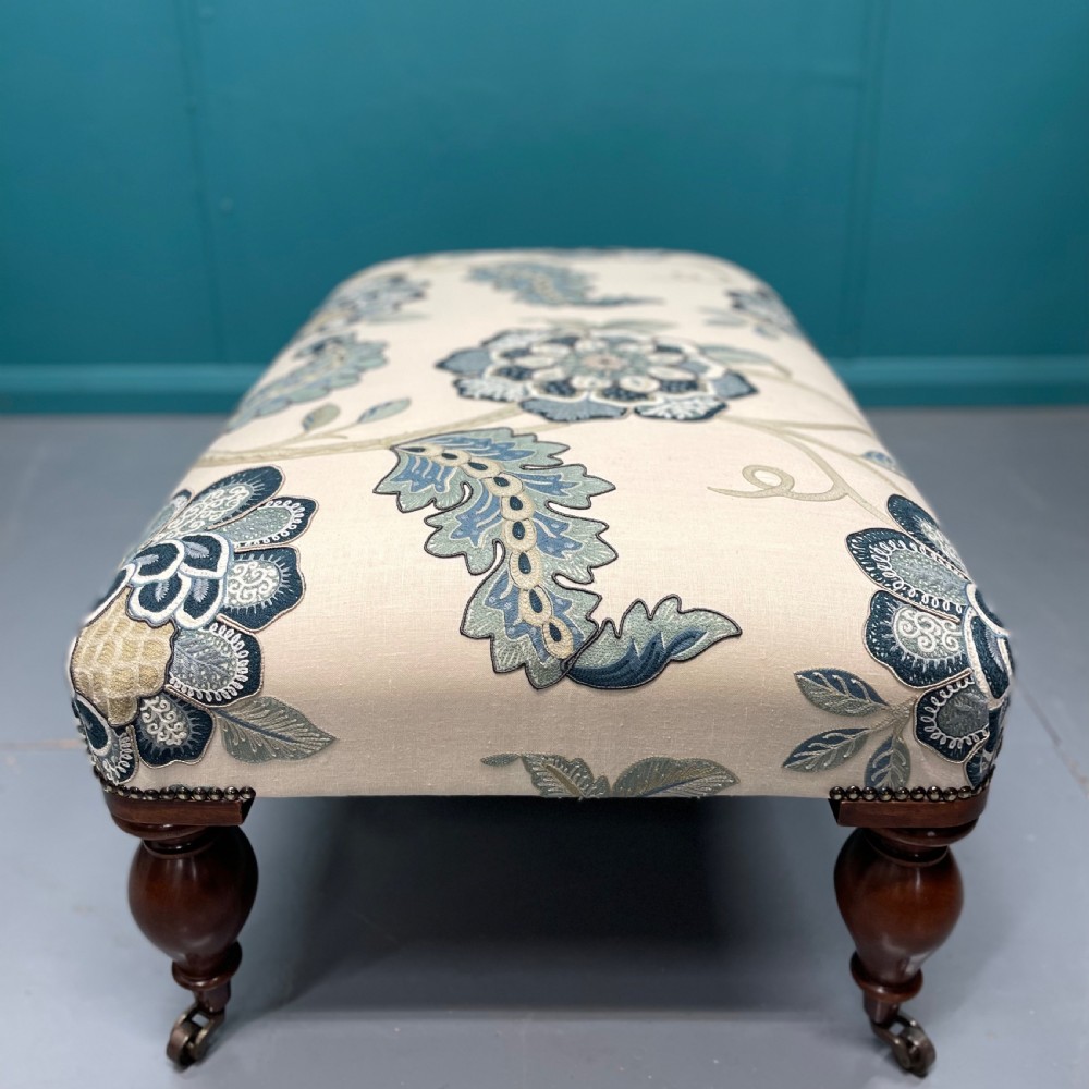 Newly upholstered ottoman footstool on bulbous legs View IV