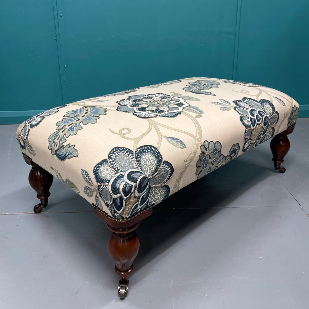Newly upholstered ottoman footstool on bulbous legs View VI