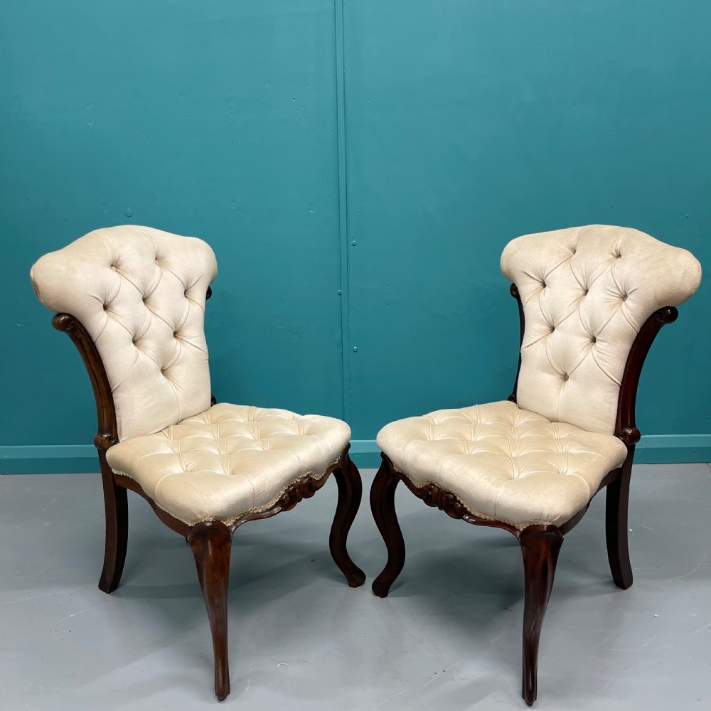 Pair of buttoned occasional side chairs