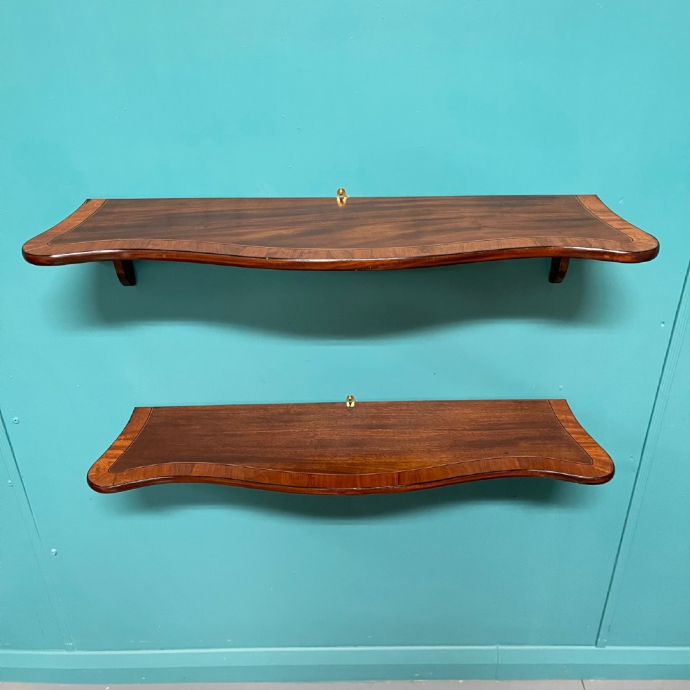 Pair of serpentine hanging shelves
