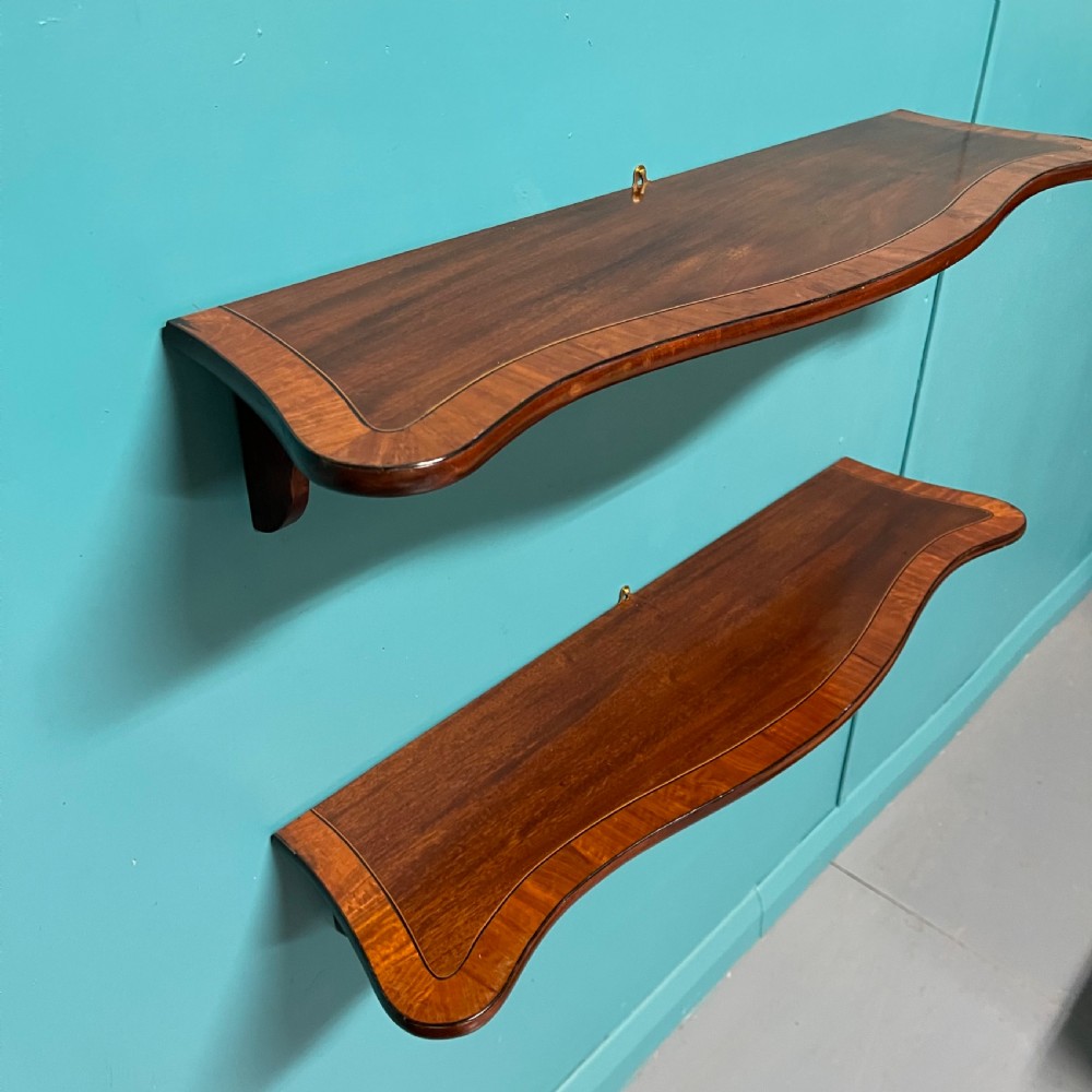 Pair of serpentine hanging shelves View II