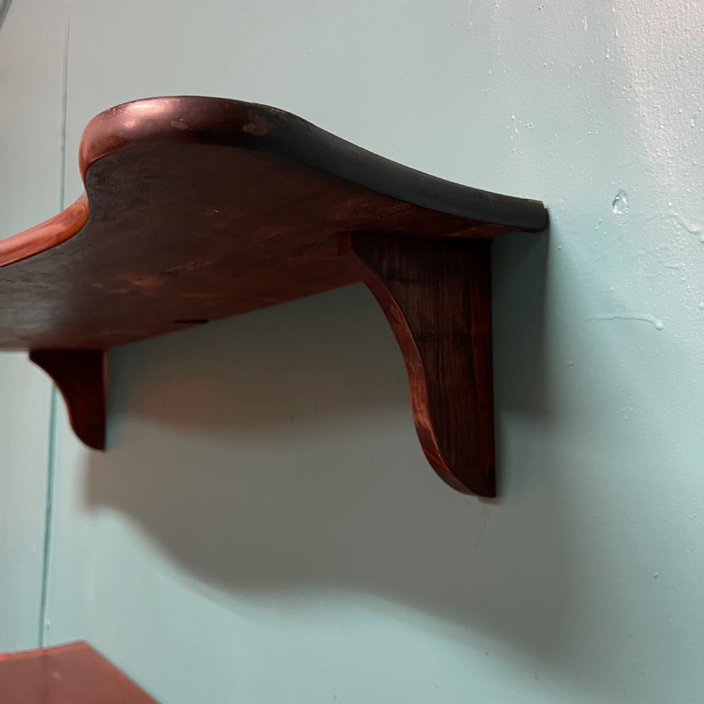 Pair of serpentine hanging shelves View IV