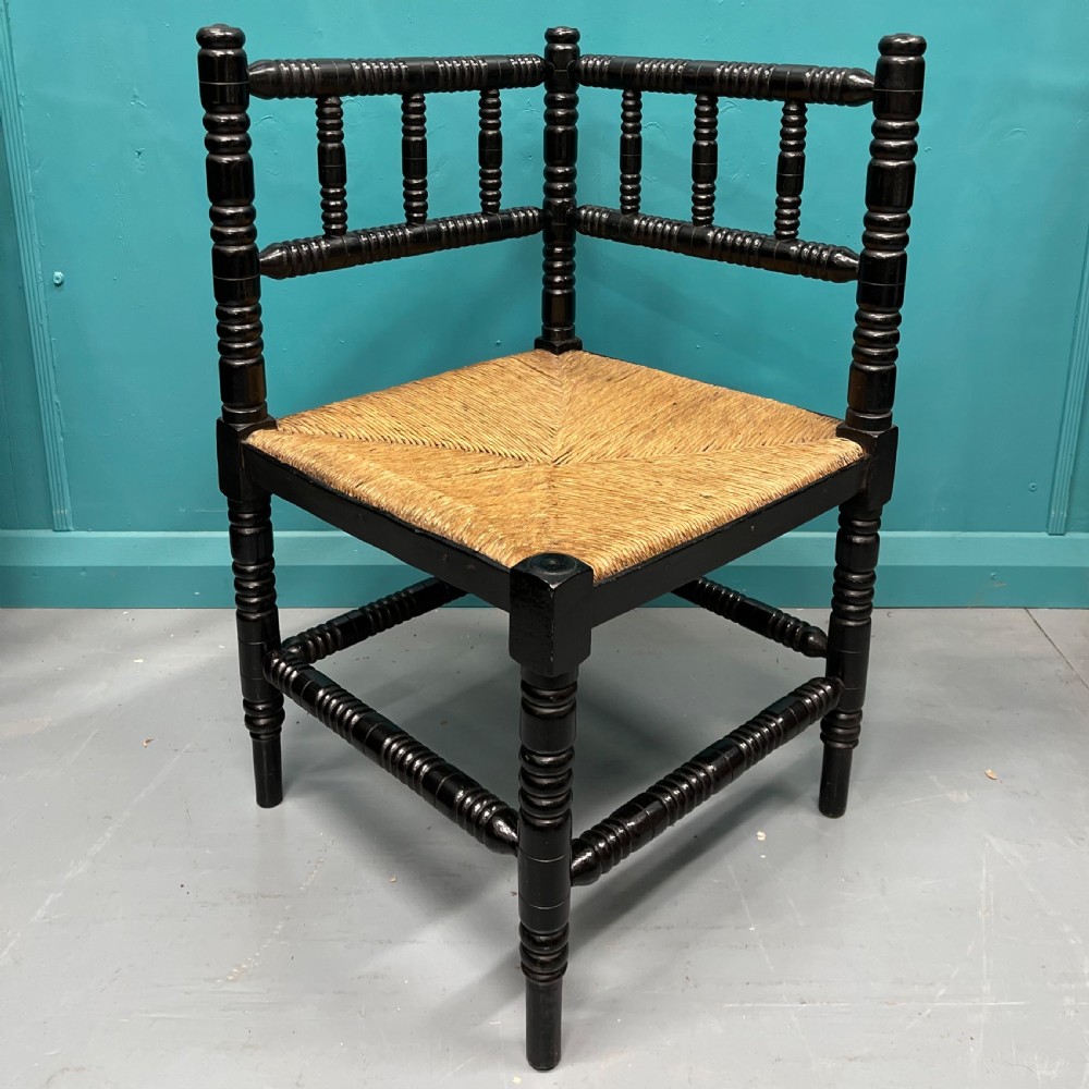 Black lacquered bobbin turned corner chair