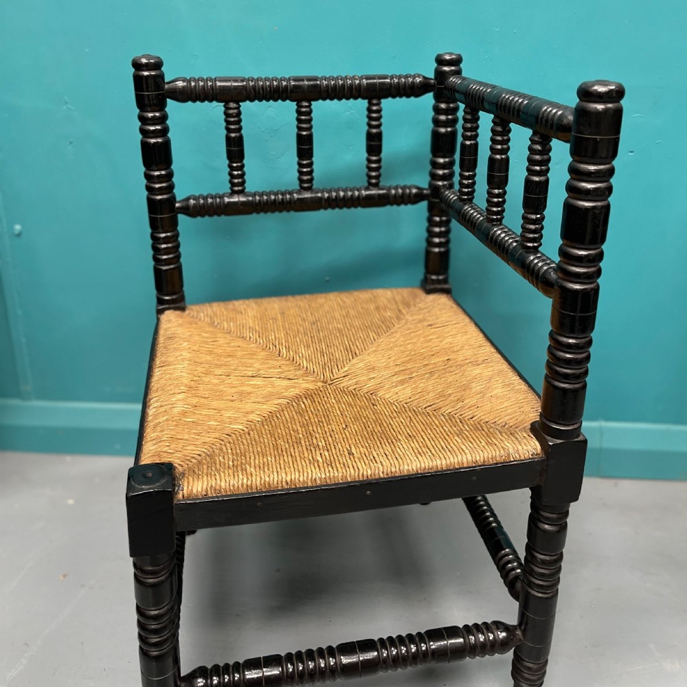 Black lacquered bobbin turned corner chair View III
