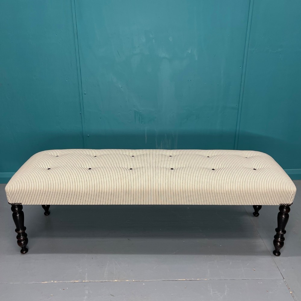 Victorian buttoned long stool on ebonised legs