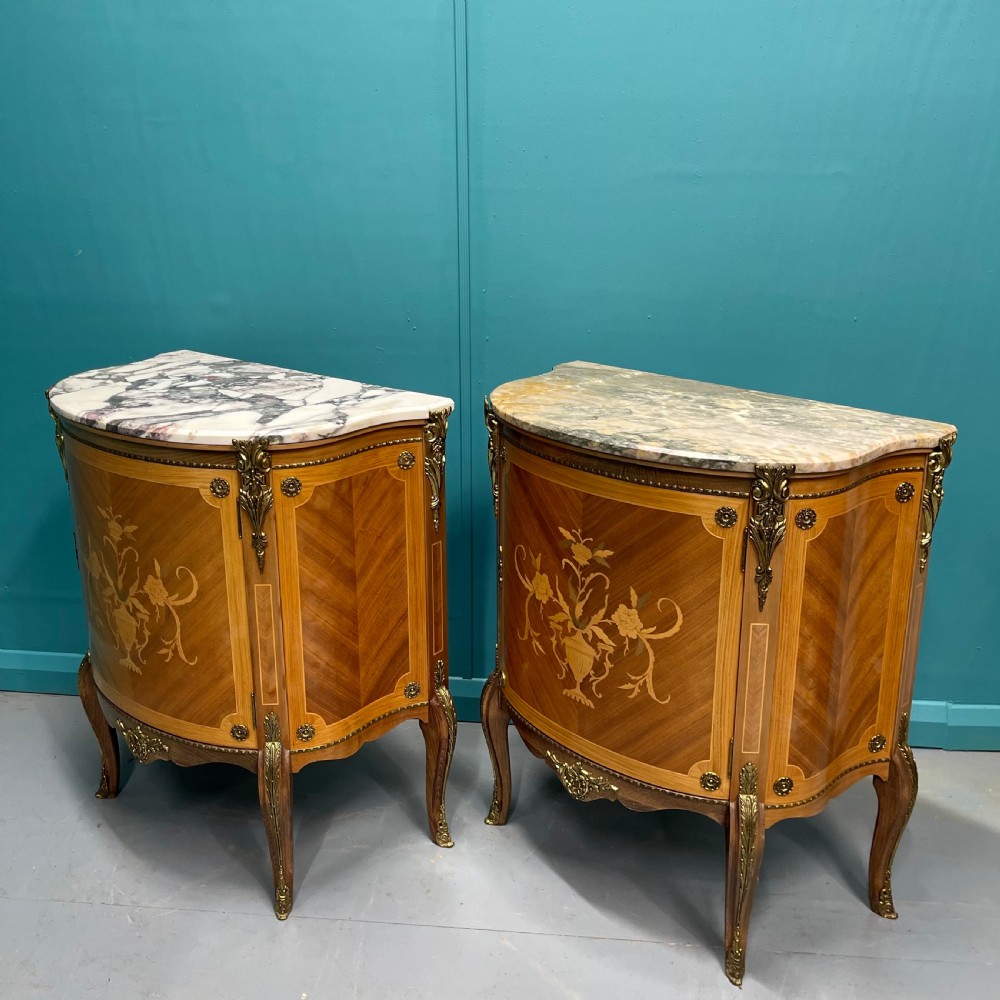 Pair of French marble top pier cabinets