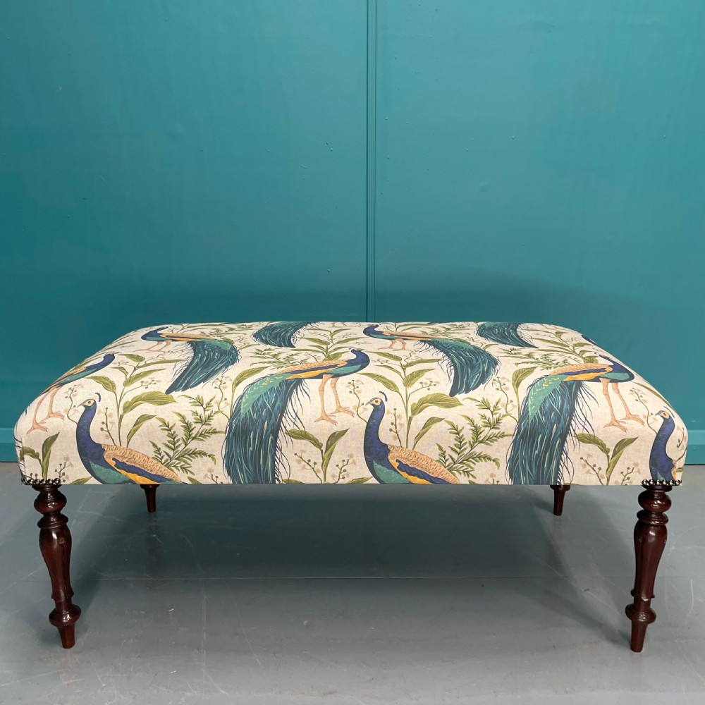 Newly upholstered peacocks ottoman footstool