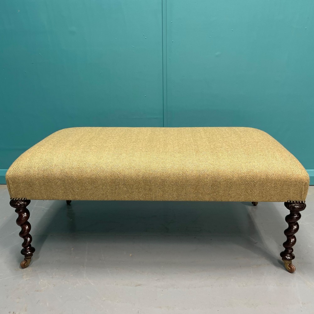 Newly upholstered tweed ottoman with barley twists