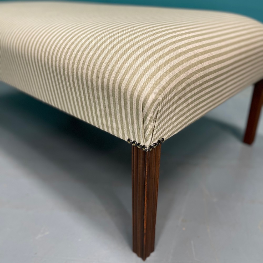 Newly upholstered olive stripe ottoman footstool View VI