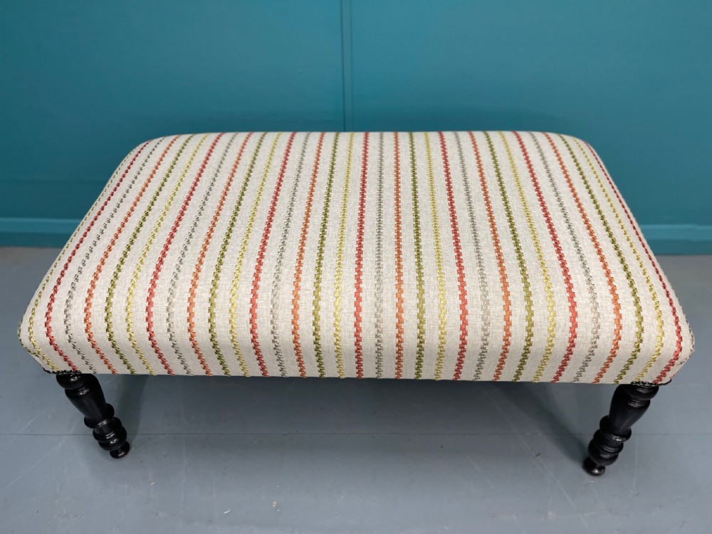 Newly upholstered ottoman stool on ebonised legs  View VII