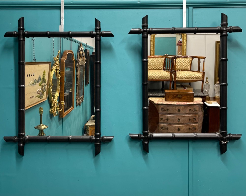 Pair of ebonised faux bamboo mirrors