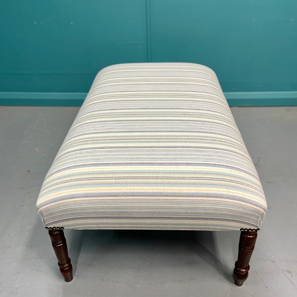 Newly upholstered pastel stripe ottoman stool View V