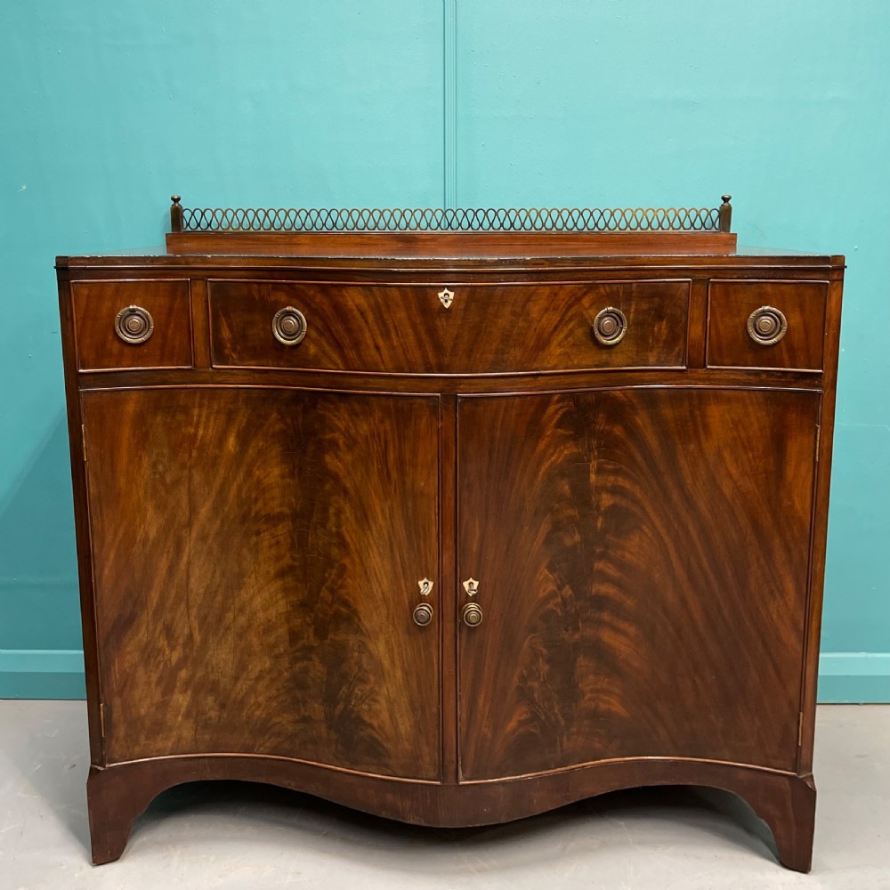Serpentine mahogany server sideboard with brass gallery View II