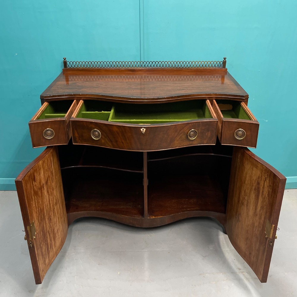 Serpentine mahogany server sideboard with brass gallery View V