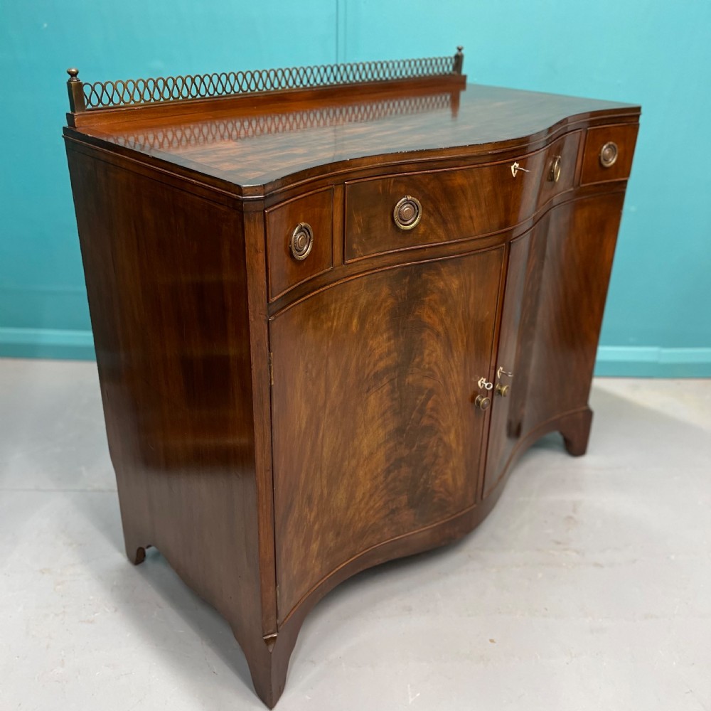 Serpentine mahogany server sideboard with brass gallery View VII
