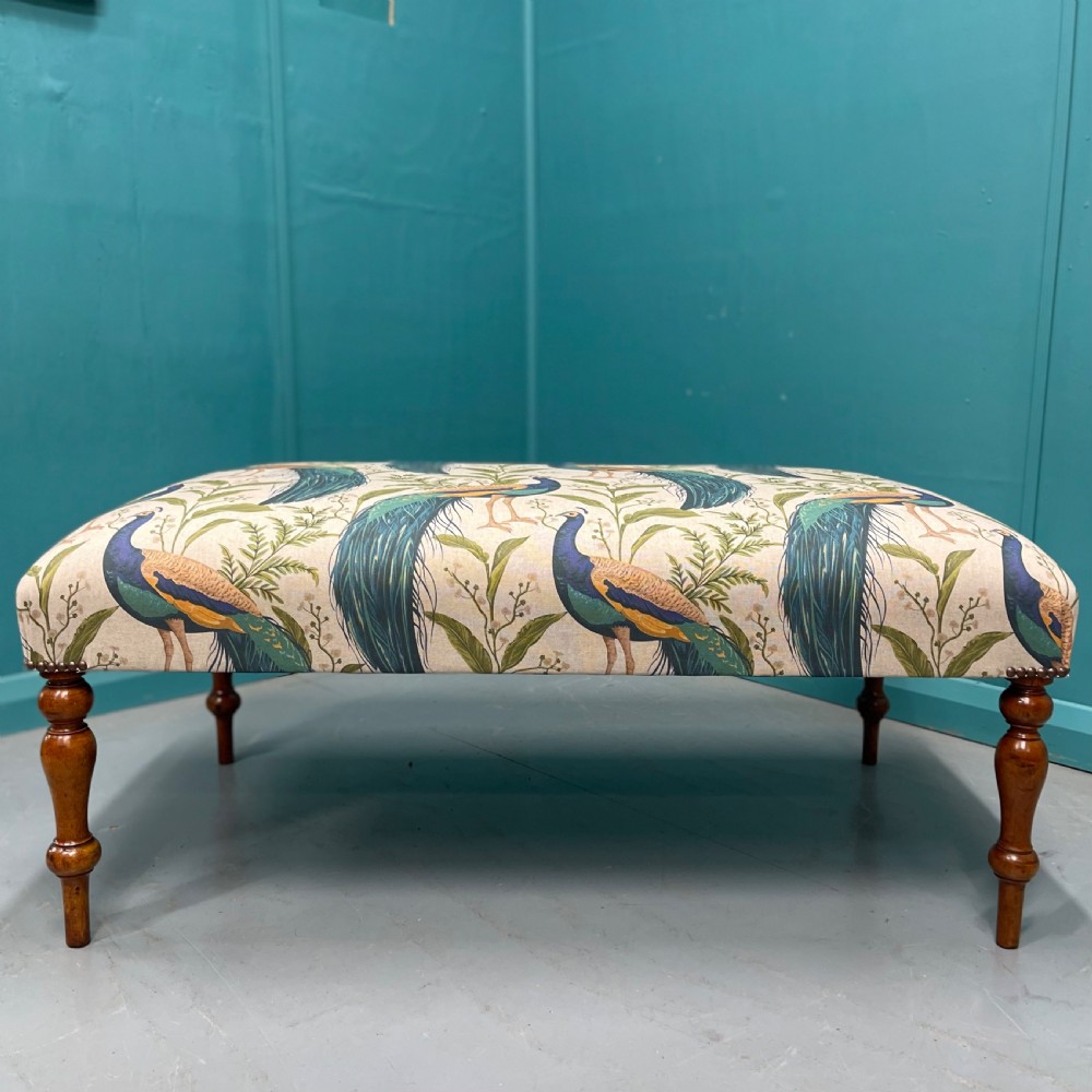 Newly upholstered ottoman footstool with peacocks View II