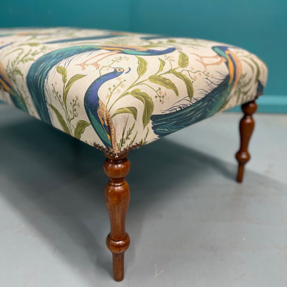 Newly upholstered ottoman footstool with peacocks View III