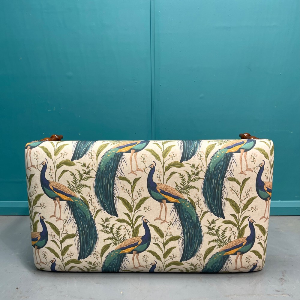 Newly upholstered ottoman footstool with peacocks View V