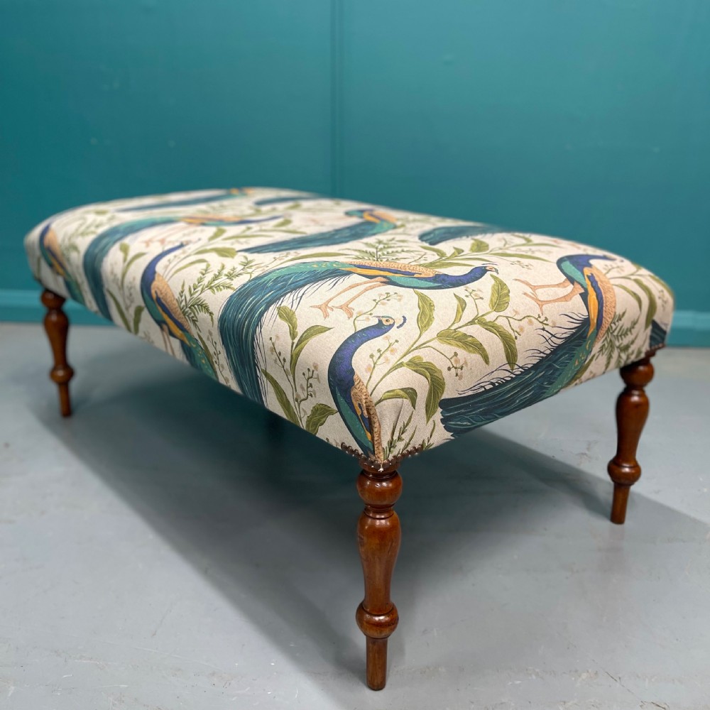 Newly upholstered ottoman footstool with peacocks View VI
