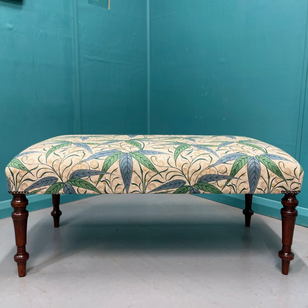 Newly upholstered Victorian ottoman footstool