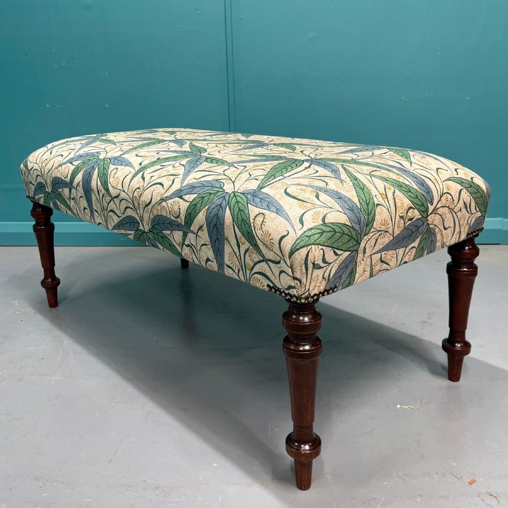Newly upholstered Victorian ottoman footstool View II