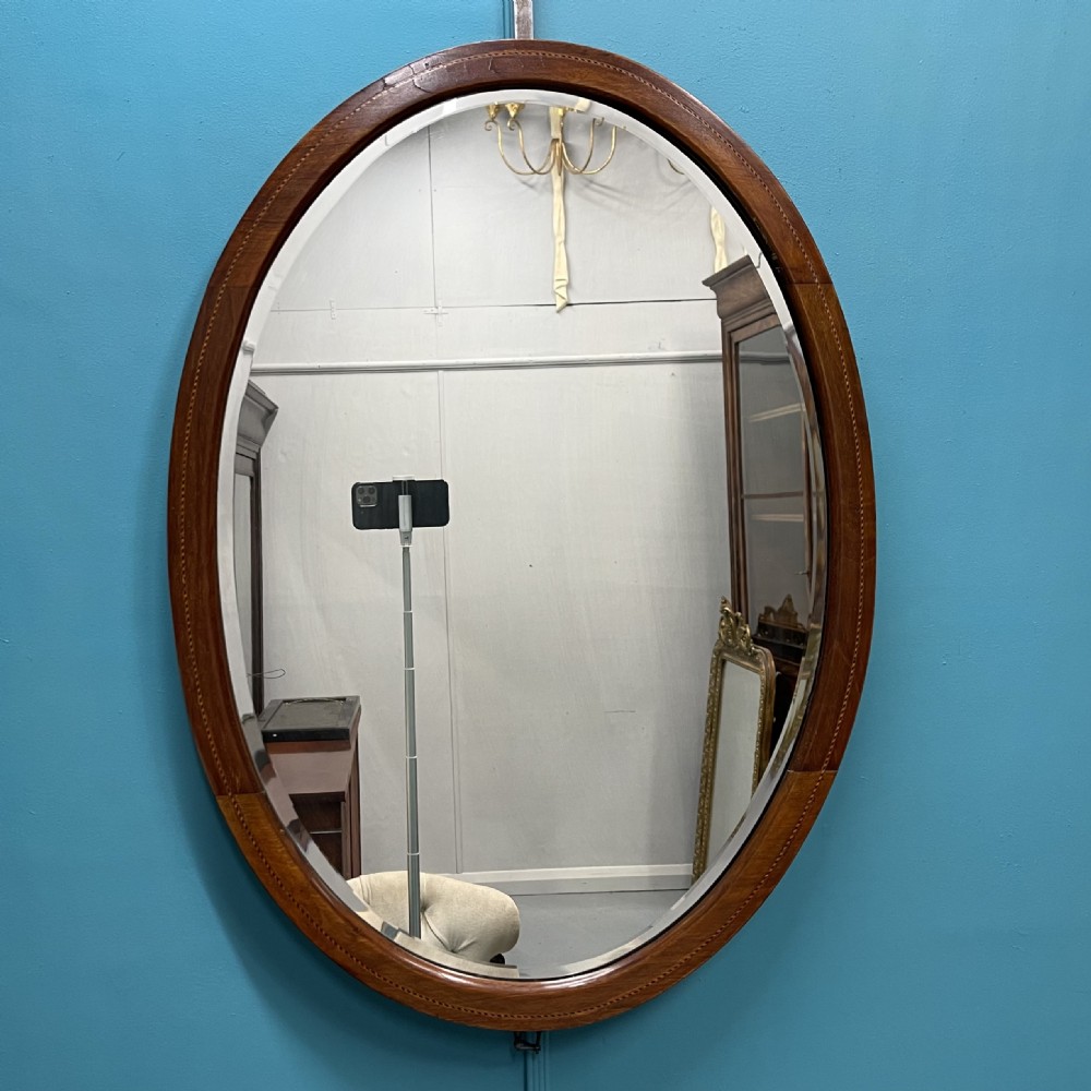 Edwardian oval inlaid mirror with bevelled glass