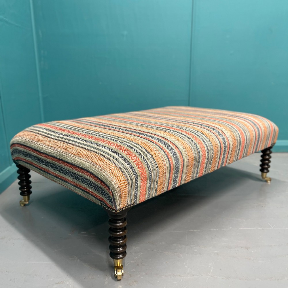 Large newly upholstered bobbin stool on castors View II