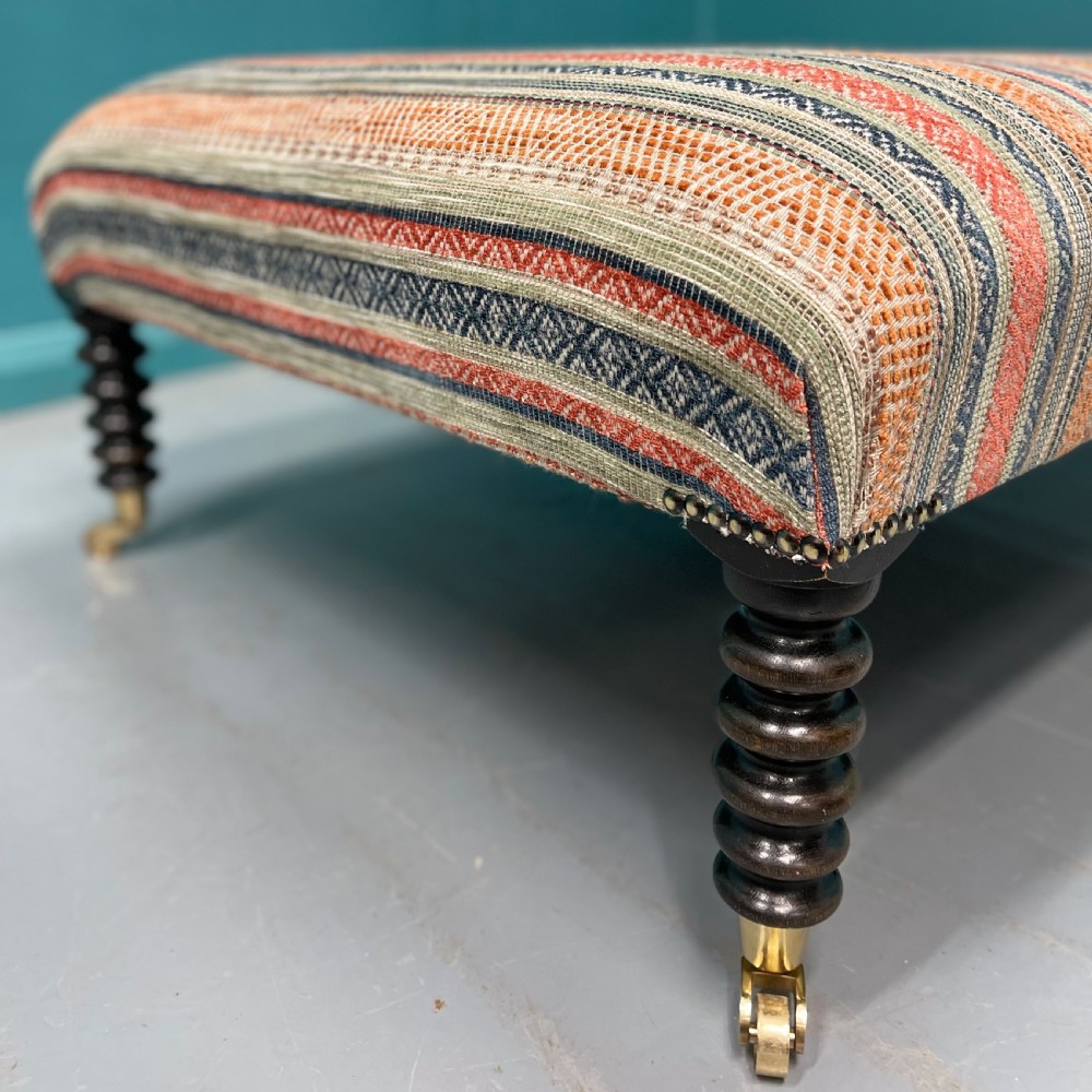 Large newly upholstered bobbin stool on castors View III