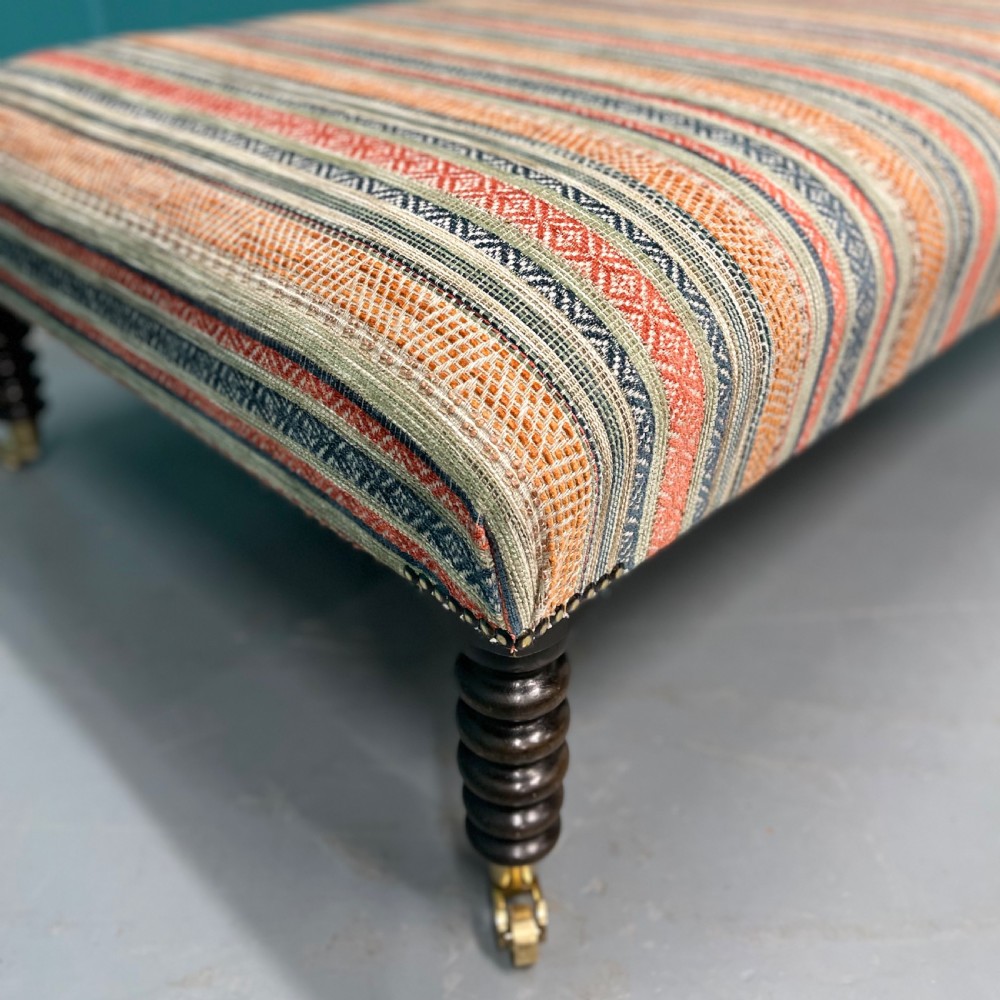 Large newly upholstered bobbin stool on castors View IV