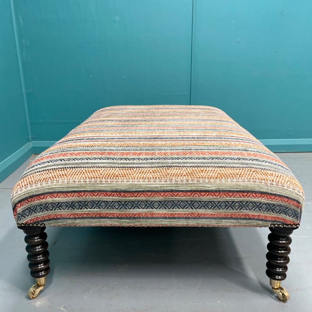 Large newly upholstered bobbin stool on castors View VI