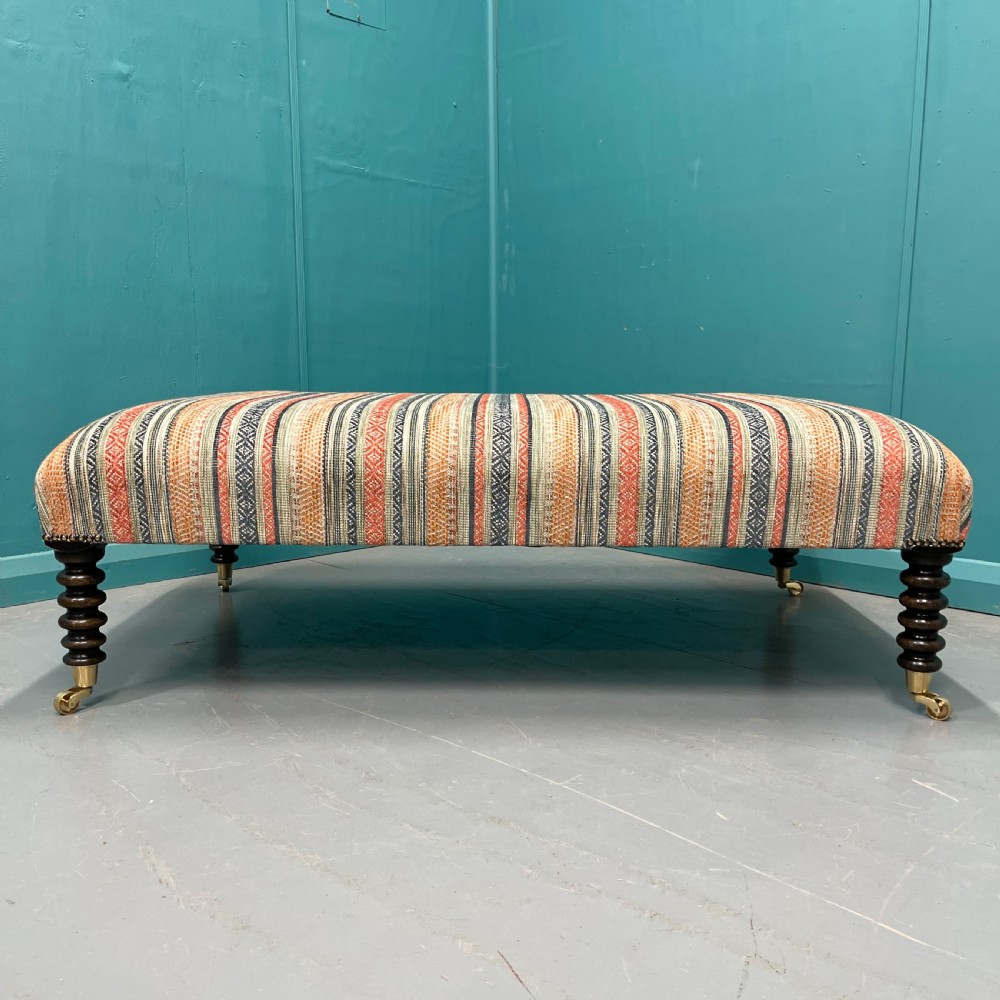 Large newly upholstered bobbin stool on castors View VII