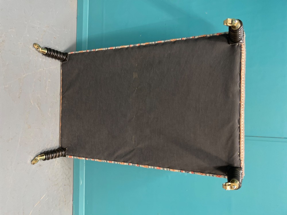 Large newly upholstered bobbin stool on castors View IX