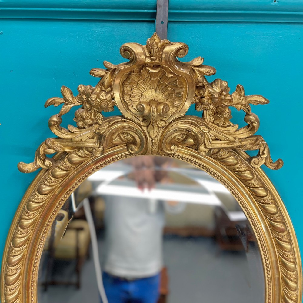 French 19th century oval gilt mirror View II