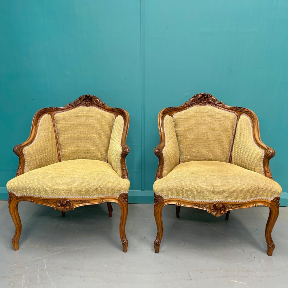 Pair of French walnut low back tub armchairs