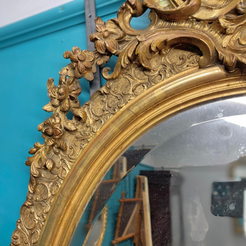 Large French oval gilt mirror with bevelled glass View V