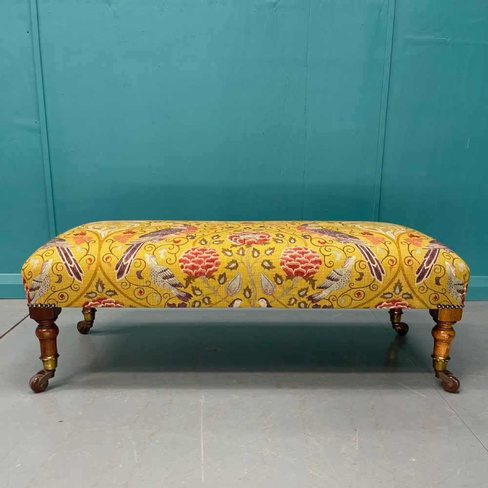 Victorian oak low footstool on castors  View II